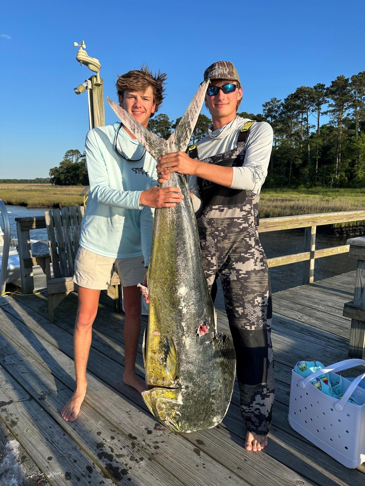 Cade Quick (left) with his record-setting dolphin.