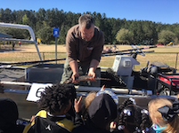 Hands-on biologist with crowd